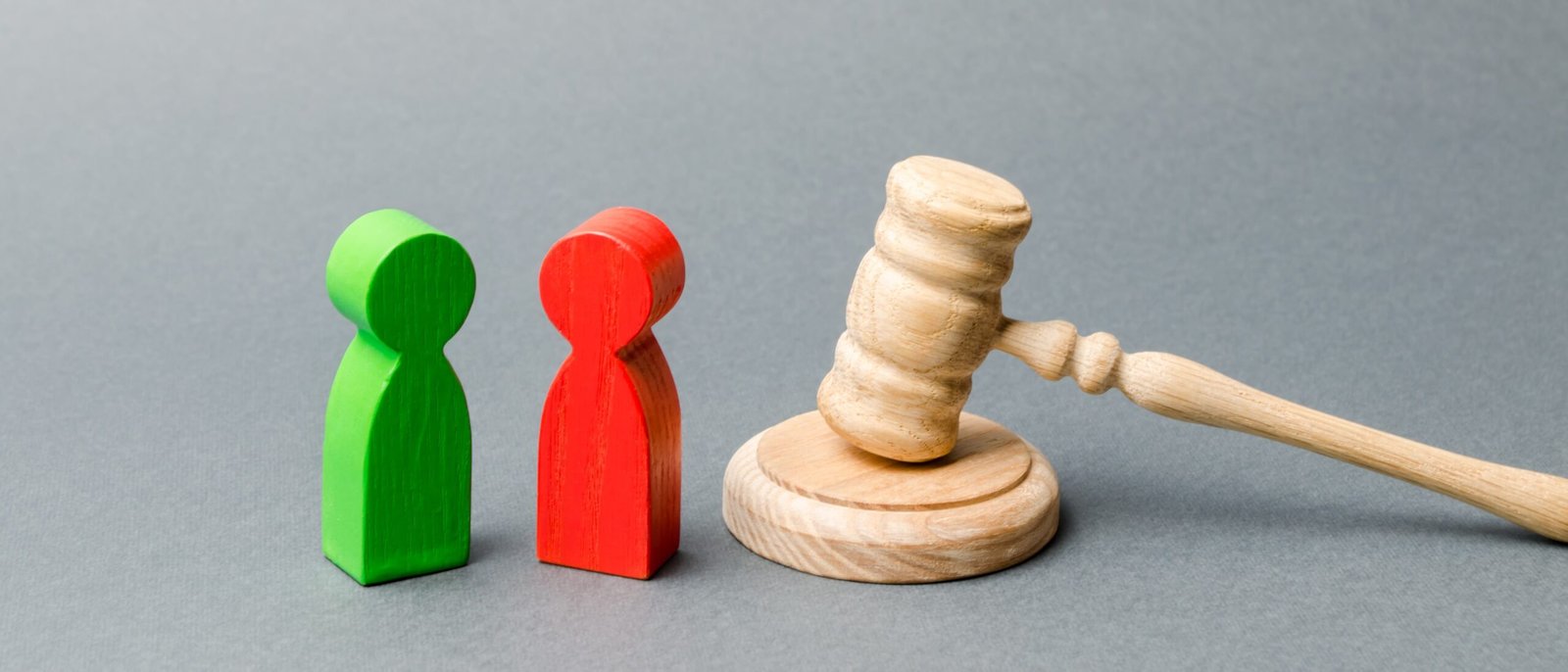 wooden-figures-of-people-standing-near-the-judge-2025-03-18-17-38-09-utc-min